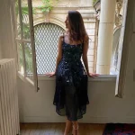 Elegant-woman-standing-in-a-window-frame