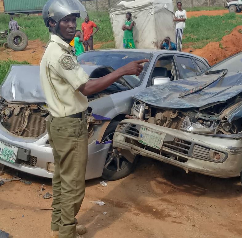 A trace operative with some of the damaged vehicle